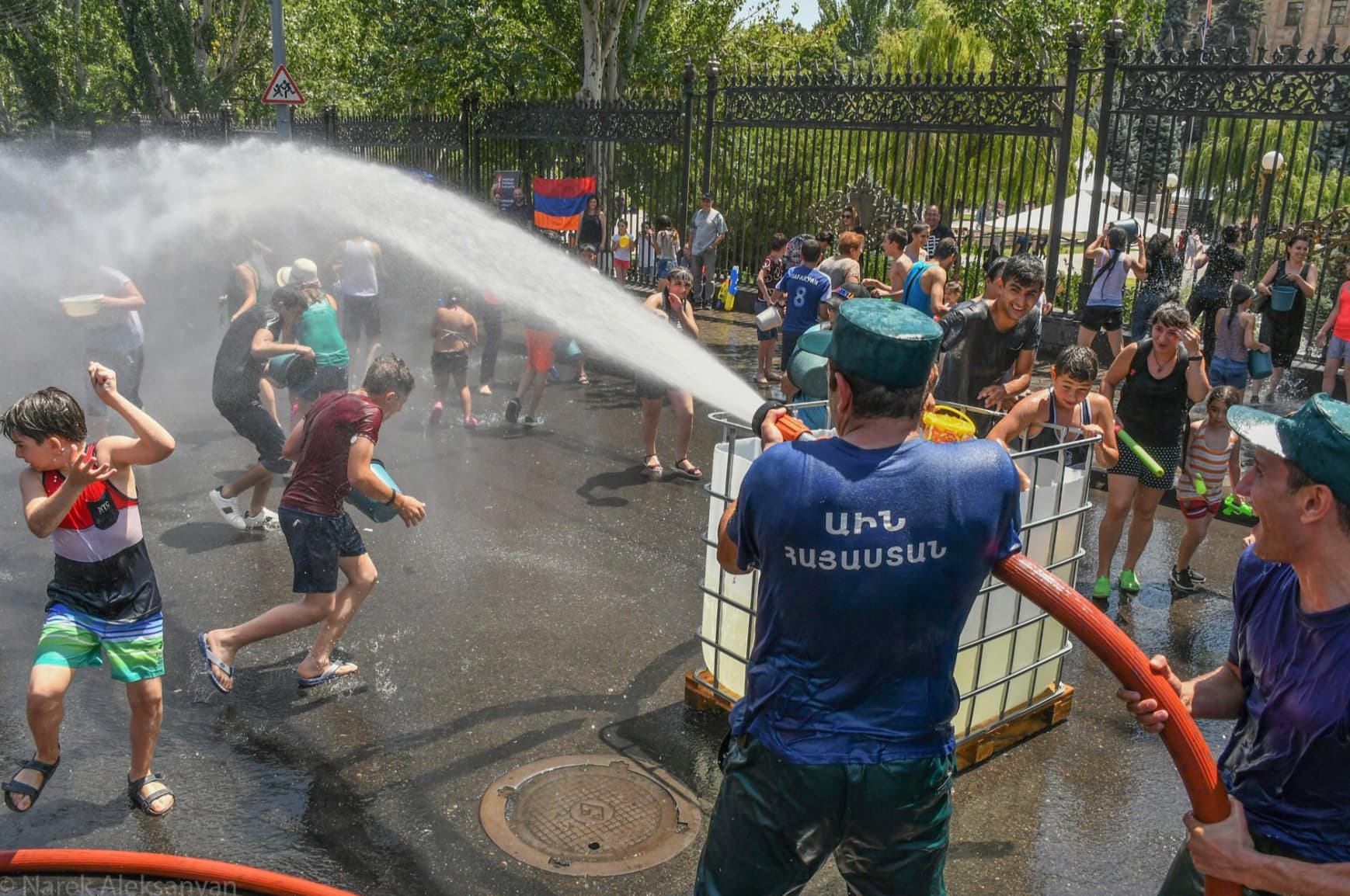 “[Photos from] ‘Vardavar’ in Armenia, a day of water, beauty, love, and fertility. Everyone waters each other on this day on the streets in the capital. This is in front of our parliament with firefighters. Vardavar dates back to pegan times, meaning roses rises.”